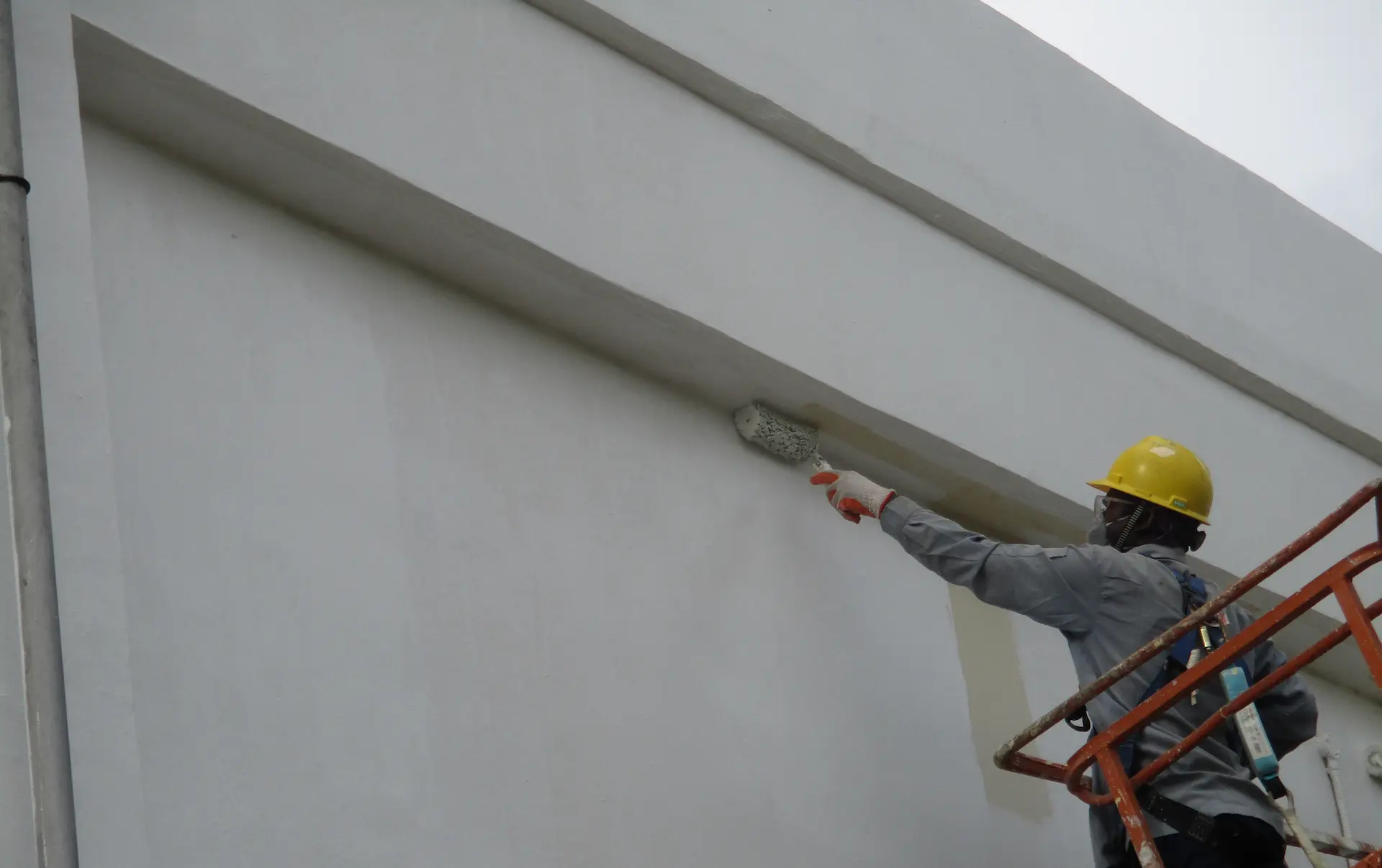 Vortex staff painting a building exterior