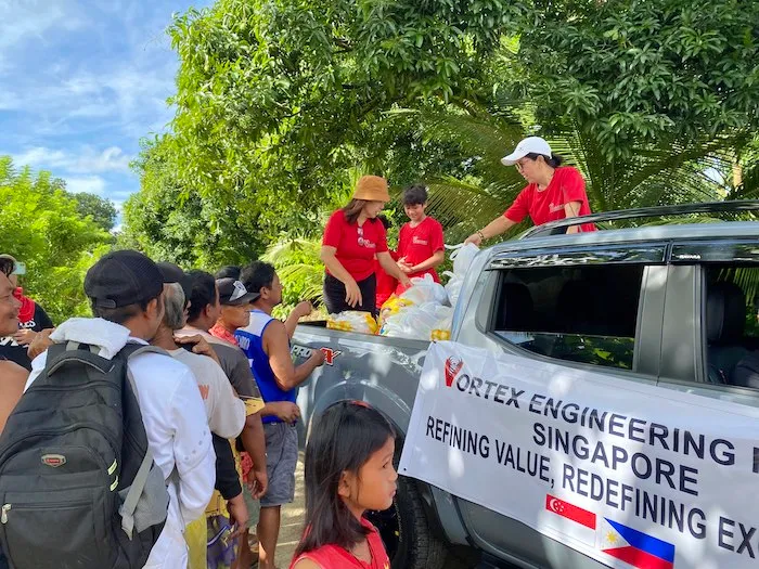 Vortex giving out food to people in the Philippines